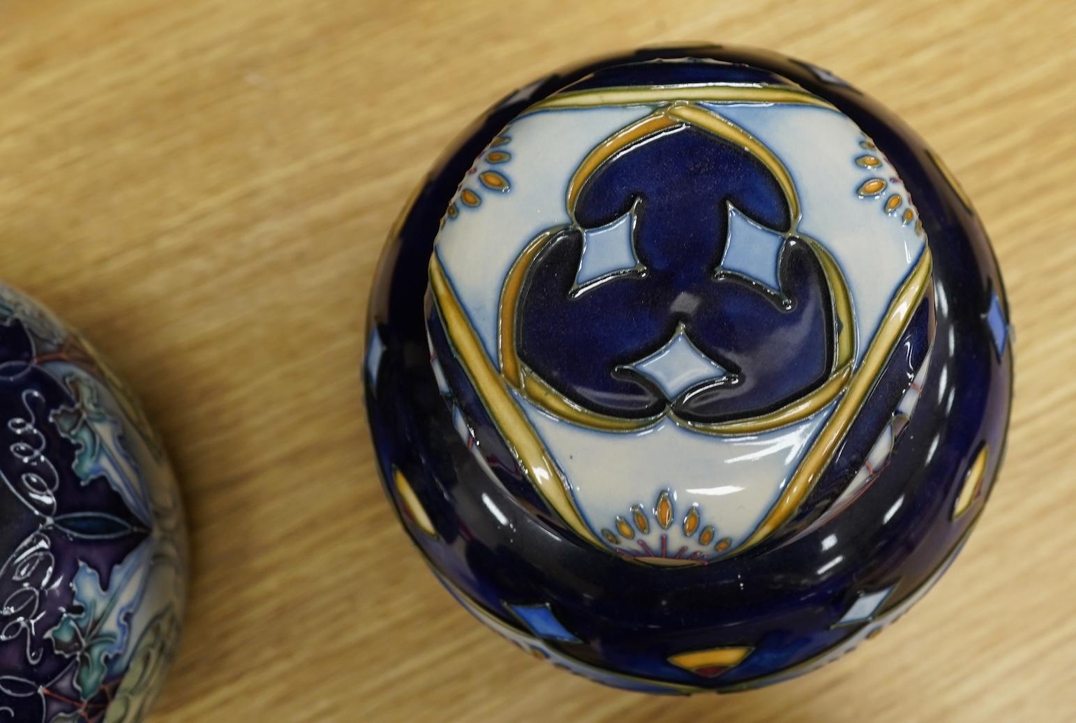Four Moorcroft ginger jars and covers - ‘Midnight Blue’, ‘Inula’, ‘Sonans’ and ‘Gustav Augusta’ (4) 17cm high